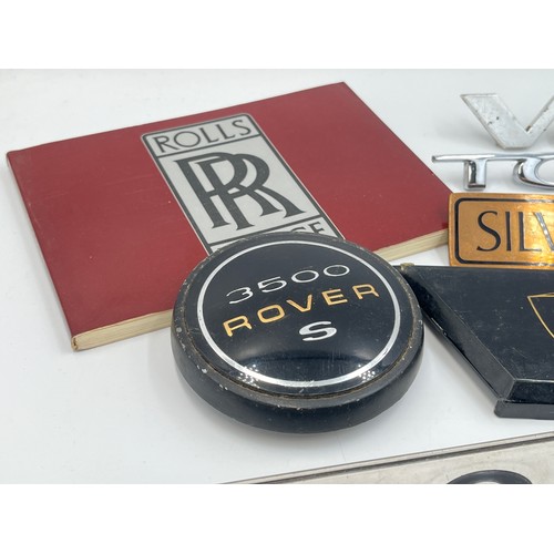 2301 - A collection of automobilia to include Rolls-Royce Silver Wraith II car badge, 3500 Rover S car badg... 