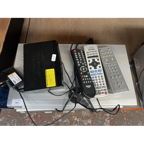 832 - Three items with remote controls, one Panasonic NV-VP31 DVD/VCR combo, one Prism DV-302 DVD player a... 