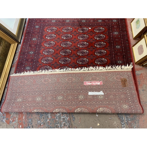 259 - A vintage Super Keshan 100% wool machine woven rug - approx. 208cm long x 141cm wide