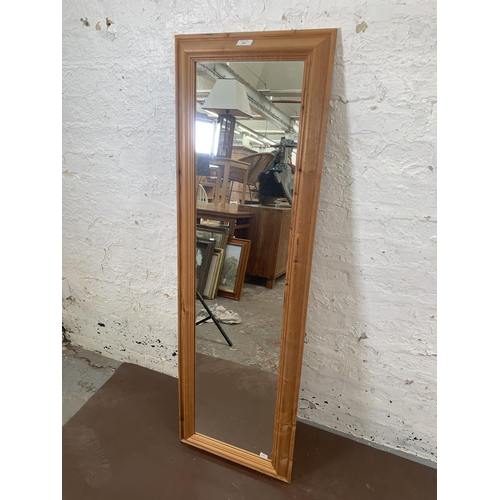 269 - A modern pine framed wall mirror - approx. 131cm high x 41cm wide