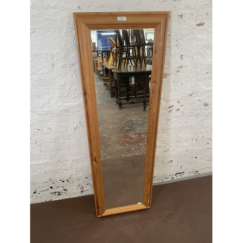 269 - A modern pine framed wall mirror - approx. 131cm high x 41cm wide