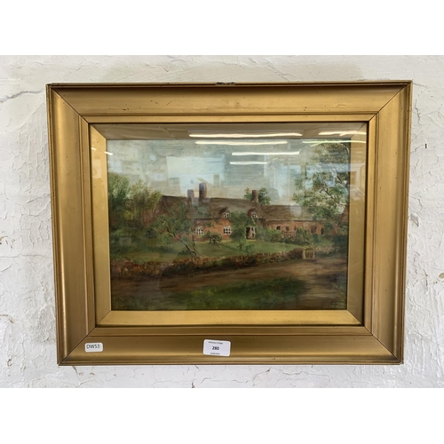 280 - An early 20th century gilt framed oil painting of a cottage scene, signed lower right ES - approx. 3... 