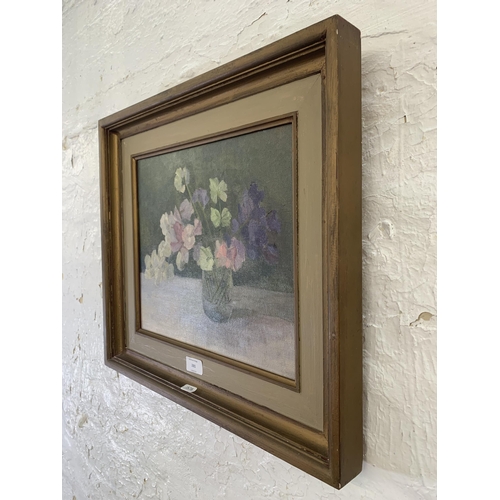 281 - A 20th century framed floral still life oil on canvas - approx. 44cm high x 49cm wide