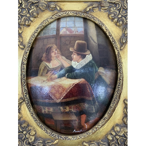 282 - A gilt framed oil on board of a couple signed lower right - approx. 41cm high x 36cm wide