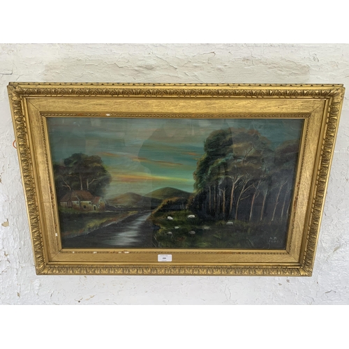 284 - An early 20th century gilt framed oil painting of a landscape scene, signed A. B. and dated 1924 - a... 