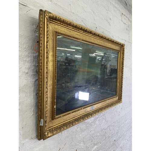 284 - An early 20th century gilt framed oil painting of a landscape scene, signed A. B. and dated 1924 - a... 