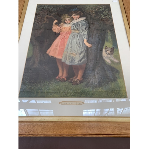 286 - Two framed prints, one titled 'Hide and Seek' by W. E. F. Britten and one other - largest approx. 80... 