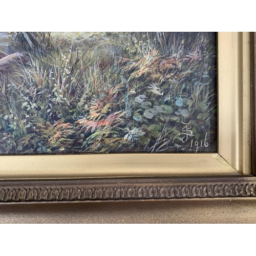 292 - Two early 20th century gilt framed landscape scene oil paintings on canvas, signed JS and dated 1916... 