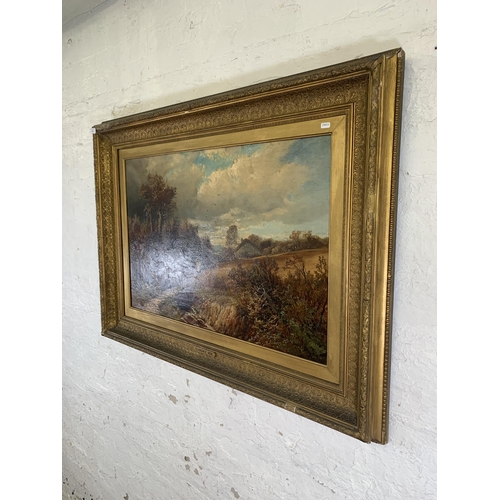 301 - A 19th century gilt framed Clarence Roe (1850-1909) oil on canvas of a landscape scene - approx. 92c... 