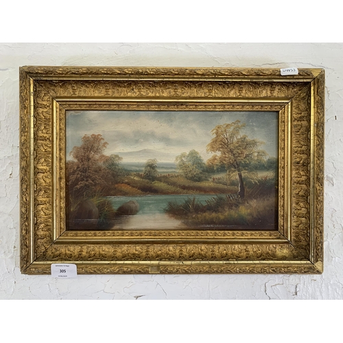 305 - A late 19th/early 20 century gilt framed oil on board of a  landscape scene - approx. 33cm high x 48... 