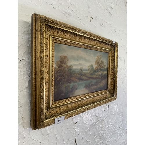 305 - A late 19th/early 20 century gilt framed oil on board of a  landscape scene - approx. 33cm high x 48... 