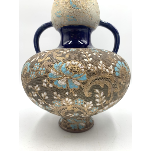 319 - An early 20th century Doulton & Slaters Patent hand painted stoneware twin handled vase with impress... 