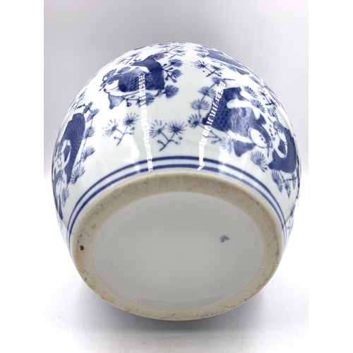 321 - A Chinese blue and white porcelain ginger jar and cover with Koi carp decoration - approx. 29cm high