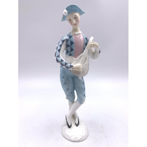 328 - Two Royal Doulton figurines, Melody HN2202 and Harlequin HN2186