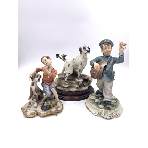 340 - Three Capodimonte porcelain figurines, English setter, Postman and Boy & Dog