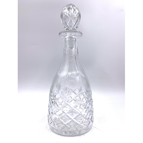 352 - Three cut glass decanters - approx. 28cm high