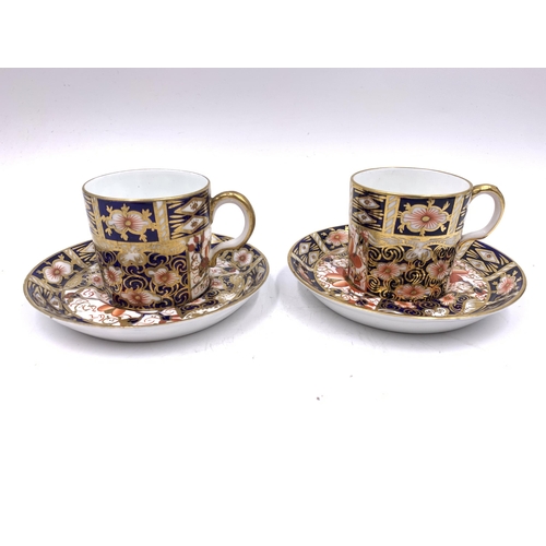 390 - Nine ceramic items, six Royal Crown Derby Traditional Imari 2451 cups and saucers and three Coalport... 