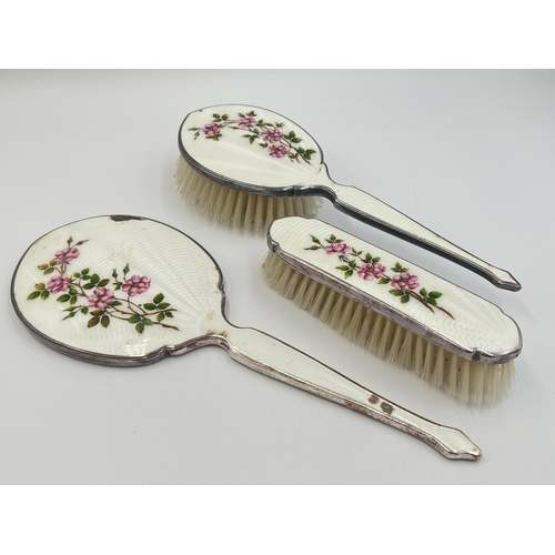 2203 - A mid 20th century Art Deco style HCD white metal and enamel three piece dressing table set comprisi... 