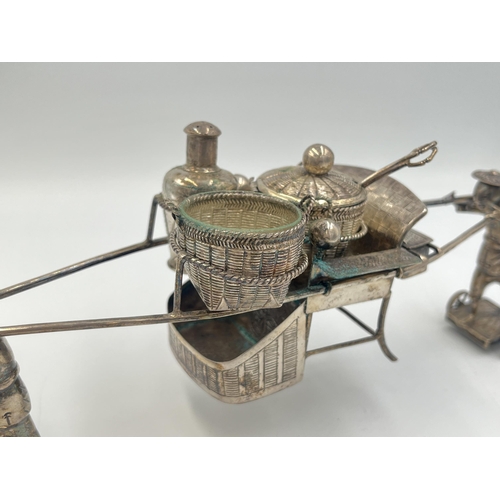 2204 - A vintage boxed Chinese 0.900 silver cruet set stamped WK, with porters carrying sedan chair and bas... 