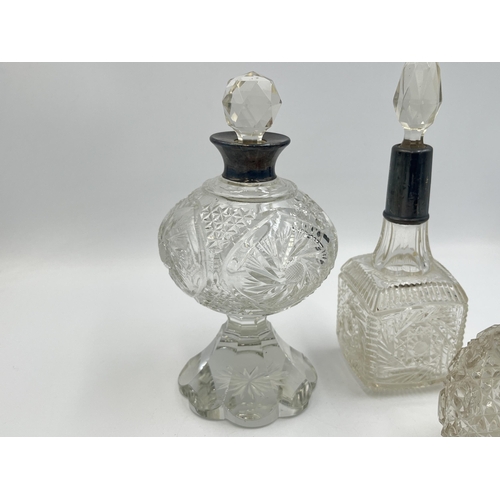 2210 - Four antique hallmarked silver and cut glass perfume bottles to include Birmingham 1908, Chester 190... 