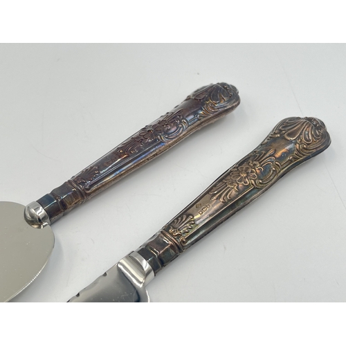 2215 - Two pieces of boxed hallmarked Sheffield silver handled cutlery, one 1970 cake knife and one 1978 se... 