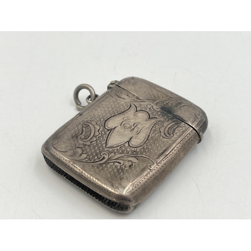 2217 - Four pieces of hallmarked silver, one Birmingham vesta case dated 1903, one Birmingham vesta case da... 