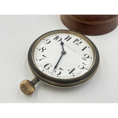 2221 - A 1930s Finnigan's Goliath 8 day pocket watch with Swiss movement and turned teak stand