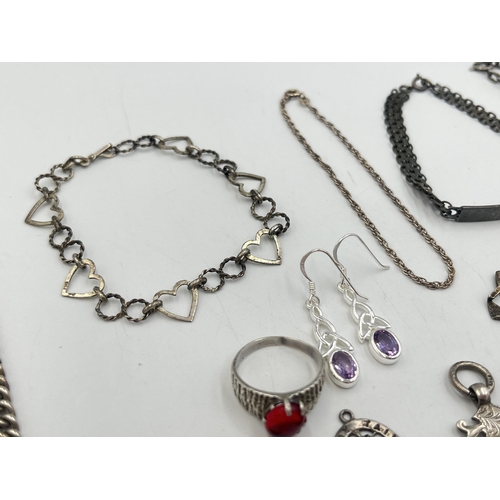 2242 - A collection of hallmarked and stamped silver jewellery to include charm bracelet, two ID bracelets,... 