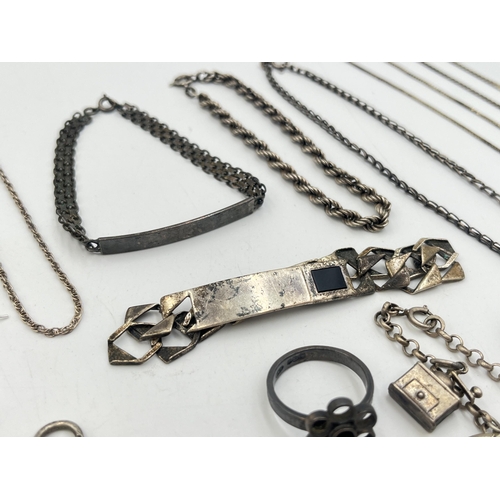 2242 - A collection of hallmarked and stamped silver jewellery to include charm bracelet, two ID bracelets,... 