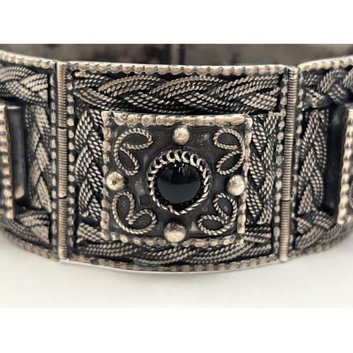 2244 - An Egyptian silver and black onyx panel bracelet - approx. gross weight 64g and approx. 17cm long