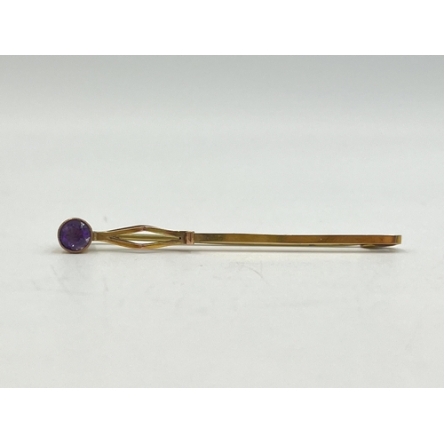 2245 - A 9ct gold amethyst set pin brooch with metal pin - approx. gross weight 1.5g