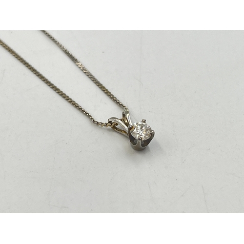 2249 - A 14ct white plumb gold diamond pendant necklace - approx. gross weight 2.45g