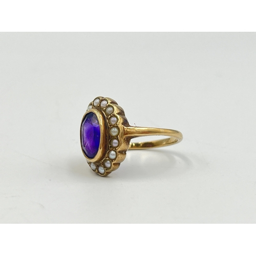 2251 - A hallmarked 9ct gold amethyst and seed pearl halo ring, size O - approx. gross weight 4.3g