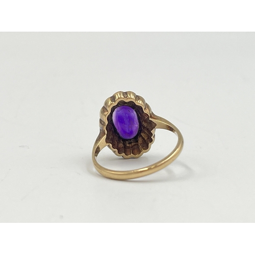 2251 - A hallmarked 9ct gold amethyst and seed pearl halo ring, size O - approx. gross weight 4.3g