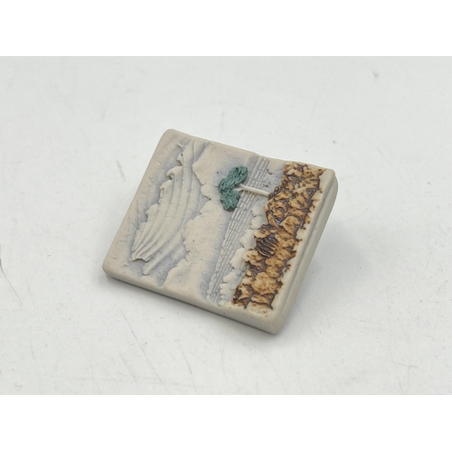 2258 - Two pieces of boxed jewellery, one Dunnydeer studio porcelain landscape brooch by Duncan C. Hood B.A... 