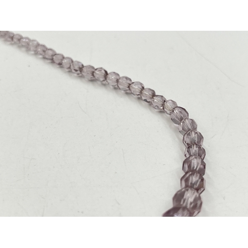 2282 - A pink faceted beaded necklace with 18ct white gold diamond set clasp