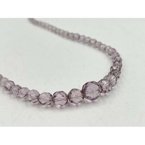 2282 - A pink faceted beaded necklace with 18ct white gold diamond set clasp