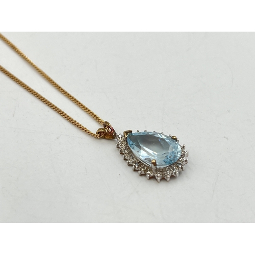 2284 - A 9ct gold diamond and aquamarine pendant necklace - approx. gross weight 5g