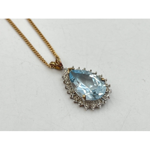 2284 - A 9ct gold diamond and aquamarine pendant necklace - approx. gross weight 5g