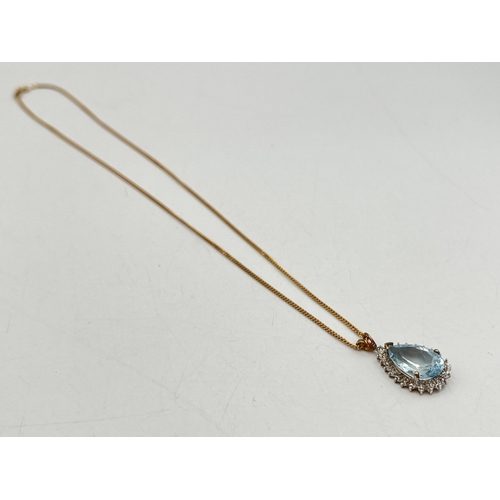 2284 - A 9ct gold diamond and aquamarine pendant necklace - approx. gross weight 5g