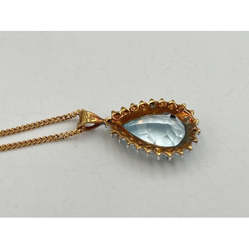 2284 - A 9ct gold diamond and aquamarine pendant necklace - approx. gross weight 5g