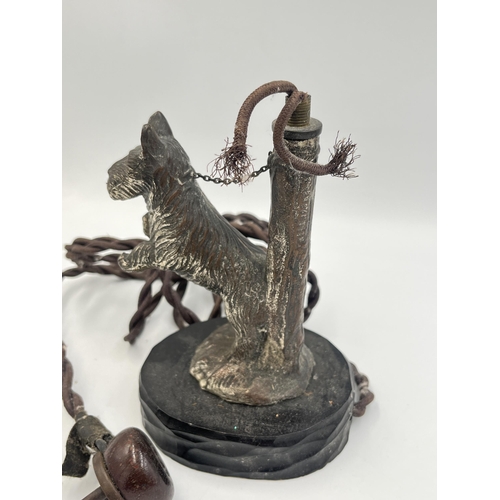 2292 - A 1930s cast metal Scottie dog table lamp on wooden base - approx. 16cm high