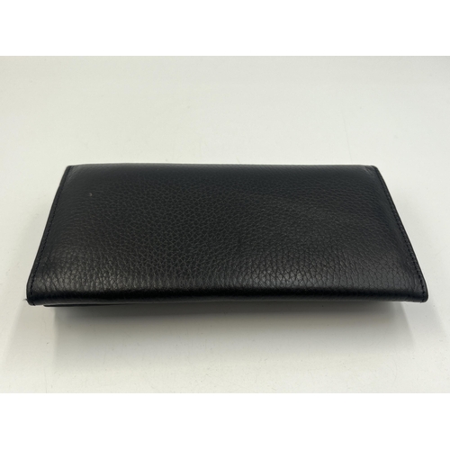 2293 - A Mulberry black leather lady's purse - approx. 10cm high x 18cm wide