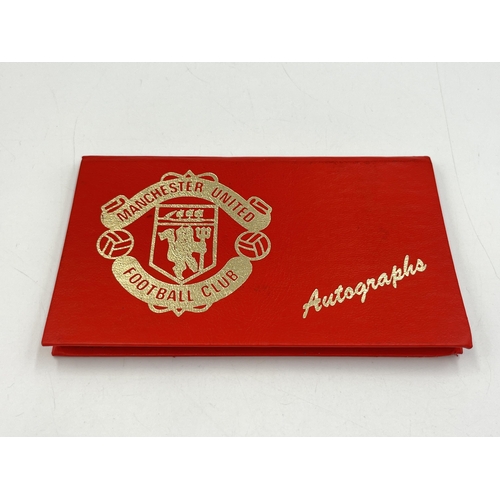 2297 - A Manchester United signed autograph book to include Alex Ferguson, Steve Bruce, Mark Hughes, David ... 