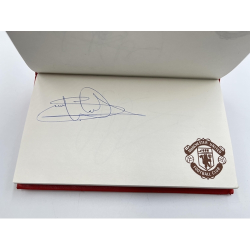 2297 - A Manchester United signed autograph book to include Alex Ferguson, Steve Bruce, Mark Hughes, David ... 