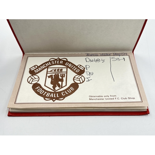 2297 - A Manchester United signed autograph book to include Alex Ferguson, Steve Bruce, Mark Hughes, David ... 