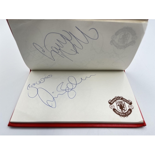 2297 - A Manchester United signed autograph book to include Alex Ferguson, Steve Bruce, Mark Hughes, David ... 