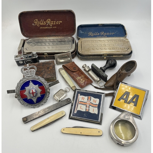 2298 - A collection of items to include mid 20th century Japanese K.K.W. Camera Lighter, Coldstream Guards ... 