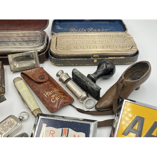 2298 - A collection of items to include mid 20th century Japanese K.K.W. Camera Lighter, Coldstream Guards ... 