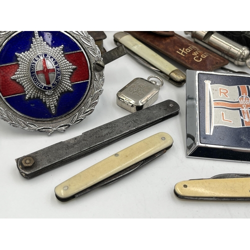 2298 - A collection of items to include mid 20th century Japanese K.K.W. Camera Lighter, Coldstream Guards ... 